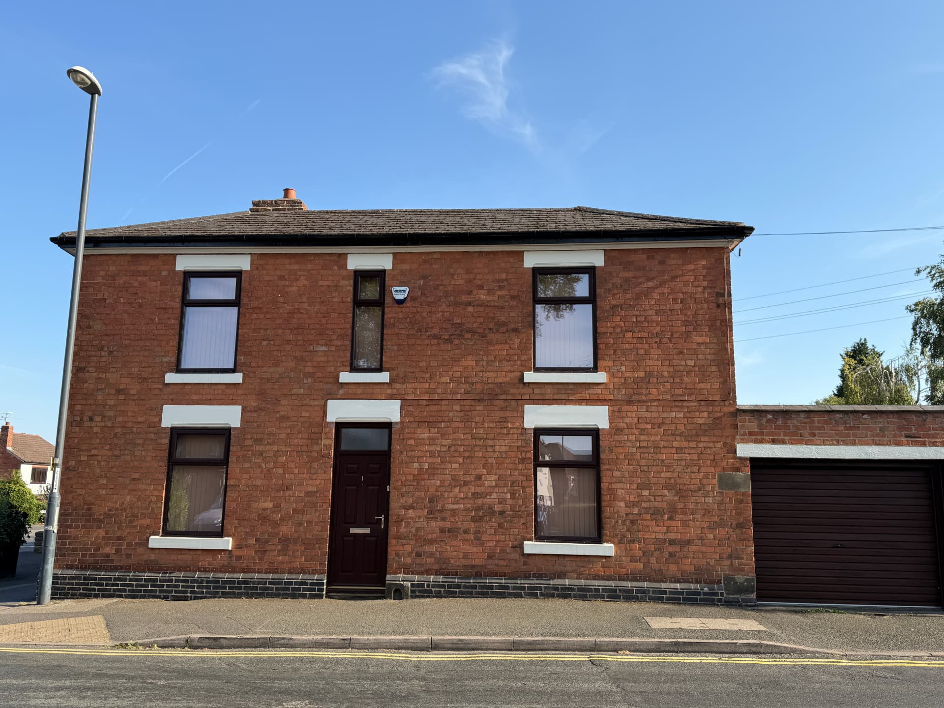 The front of 1 Park Lane, a red brick house in Allestree, Derby